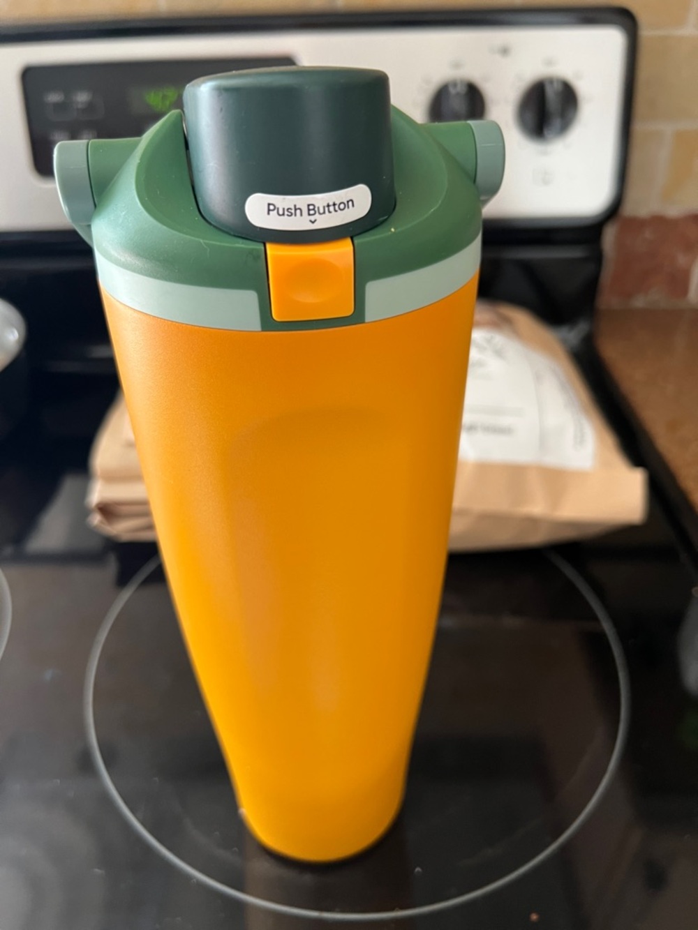 New Owala Insulated Travel Bottle in Mustard Yellow with Green Lid